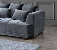 Close-up of the Aluxo Gramercy Group sofa in steel velvet, highlighting the soft texture and design details of the cushions.