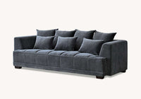 Front view of the Aluxo Gramercy sofa in Steel Velvet, featuring a chic modern design with multiple cushions, ideal for relaxation and stylish home decor.