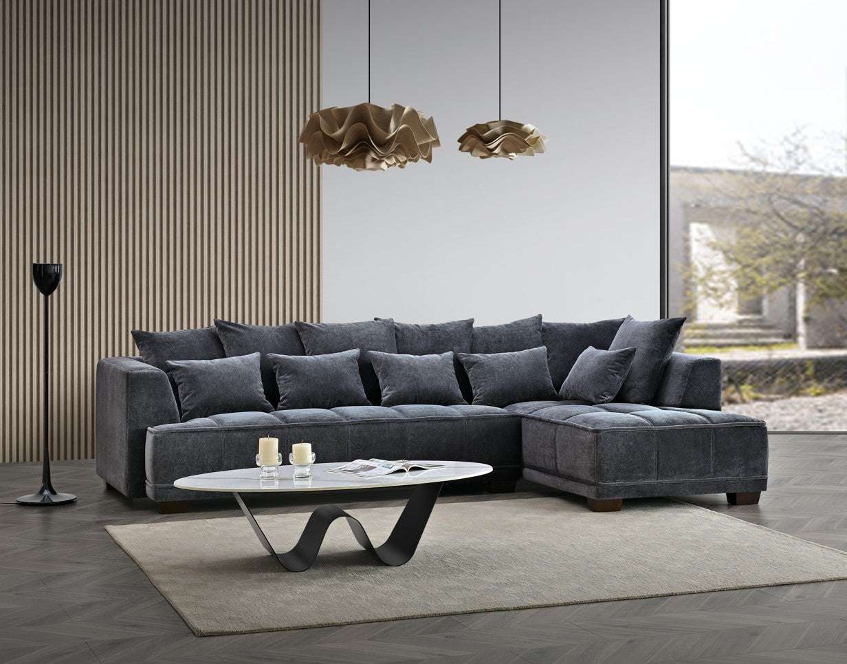 The Aluxo Gramercy Group in Steel Velvet, featuring a spacious sectional sofa with soft cushions, set in a modern living room with stylish decor.