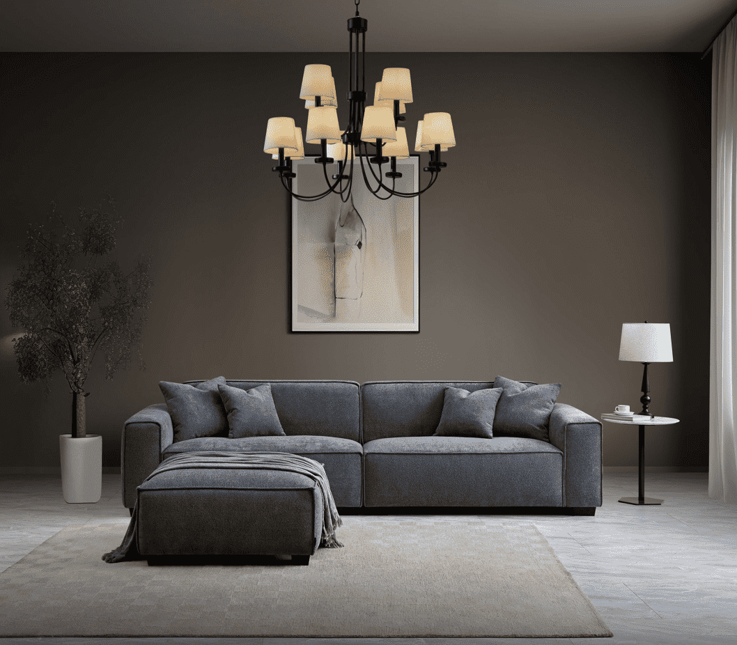 Stylish living room featuring the Aluxo Dakota Sofa Range in Charcoal Boucle, paired with a decorative chandelier and modern decor elements, showcasing comfort and elegance.