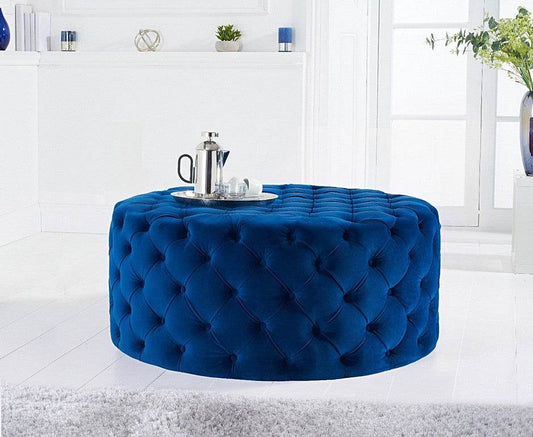 LISF LTD. Navy Blue Chesterfield Footstool in a stylish living room setting, featuring a rounded design with tufted upholstery.