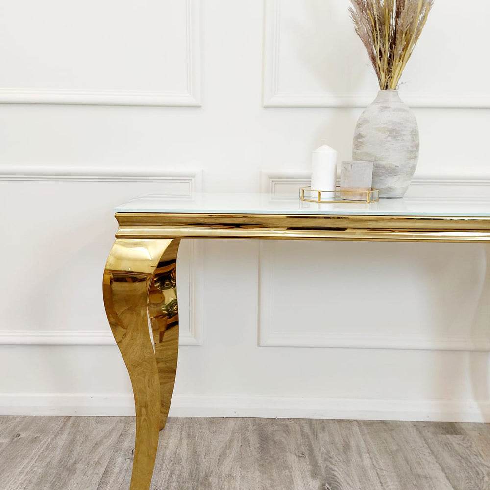 Close-up view of the Louis Gold Console Table by Furnish 365 Limited showcasing its shiny golden finish and stylish décor accents.