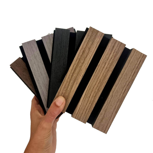 Sample boxes of Acoustic Slatted Wall Panels from Aluxo, showcasing various wood finishes, perfect for adding Luxury Furniture style to your space.