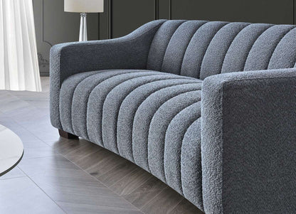 Aluxo Astoria 3 Seater Sofa in Iron Boucle Fabric - UK Luxury FurnitureAluxo Astoria 3 Seater Sofa in Iron Boucle FabricSofasAluxoUK Luxury Furniture8746763183897150952736538971Close - up of Aluxo Astoria 3 Seater Sofa in Iron Boucle Fabric, highlighting the plush fabric and intricate channel stitching that combine comfort and elegance in luxury furniture.