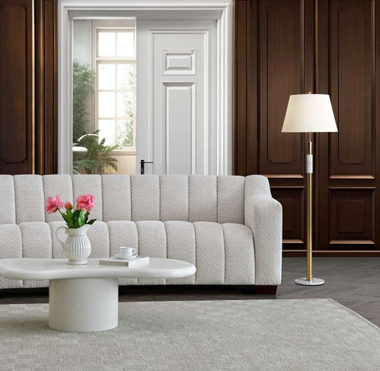 Aluxo Astoria 3 Seater Sofa in Oatmeal Boucle Fabric - UK Luxury FurnitureAluxo Astoria 3 Seater Sofa in Oatmeal Boucle FabricSofasAluxoUK Luxury Furniture8746763179941950952736899419Stylish living room featuring the Aluxo Astoria 3 Seater Sofa in Oatmeal Boucle Fabric, complemented by modern decor, showcasing luxury furniture design and comfort.