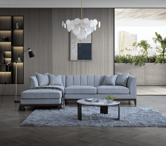 Aluxo Cooper Left Hand Corner Group in Dolphin Boucle - UK Luxury FurnitureAluxo Cooper Left Hand Corner Group in Dolphin BoucleSofasAluxoUK Luxury Furniture8746763377295550952728772955Stylish living room featuring the Aluxo Cooper Left Hand Corner Group in Dolphin Boucle. This luxurious furniture piece showcases a sleek design with deep cushions, perfect for modern interiors. The setting includes elegant decor elements like a round coffee table and a chic pendant light, accentuating the contemp