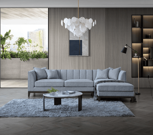 Aluxo Cooper Right Hand Corner Group in Dolphin Boucle - UK Luxury FurnitureAluxo Cooper Right Hand Corner Group in Dolphin BoucleSofasAluxoUK Luxury Furniture8746763366617150952729166171A stylish living room featuring the Aluxo Cooper Right Hand Corner Group in Dolphin Boucle, showcasing luxury furniture design with a modern aesthetic. The sofa is complemented by decorative cushions, a chic coffee table, and a soft area rug, set against a backdrop of greenery and elegant wall decor.