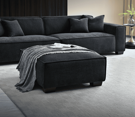 Aluxo Dakota Sofa Range Chaise in Midnight Boucle featuring a luxurious design with a cozy footstool and elegant styling, perfect for comfort in modern living spaces. Luxury Furniture.