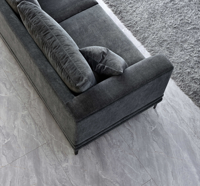 Top view of the Aluxo Lenox Sofa Range in Steel Velvet, showcasing deep cushions and sleek lines on a marble floor.