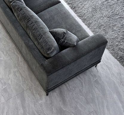 Top view of the Aluxo Lenox Sofa Range in Steel Velvet, showcasing deep cushions and sleek lines on a marble floor.