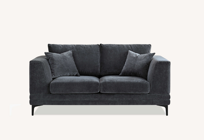 Front view of the Aluxo Lenox Sofa Range in Steel Velvet with soft cushions, set against a light neutral background.