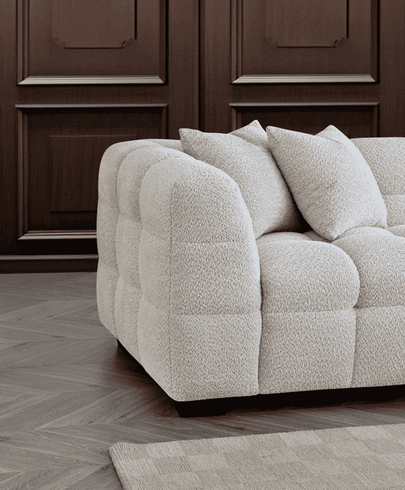 Aluxo Tribeca Right Hand Corner Group in Oatmeal Boucle Fabric - UK Luxury FurnitureAluxo Tribeca Right Hand Corner Group in Oatmeal Boucle FabricSofasAluxoUK Luxury Furniture8746763773429950952750334299Close - up view of the Aluxo Tribeca Right Hand Corner Group in Oatmeal Boucle Fabric, highlighting the plush cushioning and textured fabric against a sophisticated backdrop.