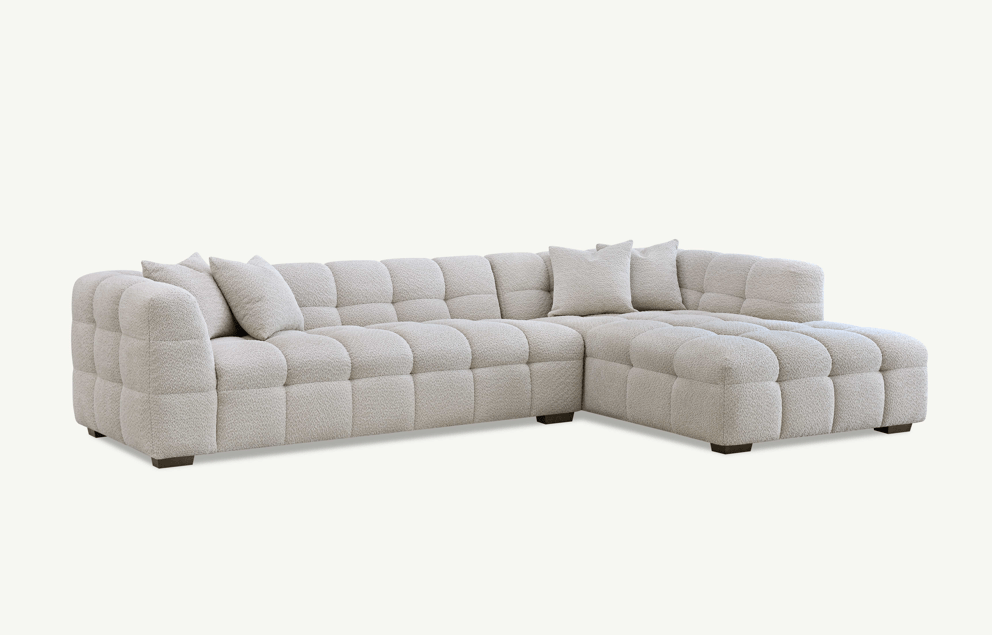 Aluxo Tribeca Right Hand Corner Group in Oatmeal Boucle Fabric - UK Luxury FurnitureAluxo Tribeca Right Hand Corner Group in Oatmeal Boucle FabricSofasAluxoUK Luxury Furniture8746763773429950952750334299Side view of the Aluxo Tribeca Right Hand Corner Group in Oatmeal Boucle Fabric, featuring a modern design with soft curves and comfortable cushions.