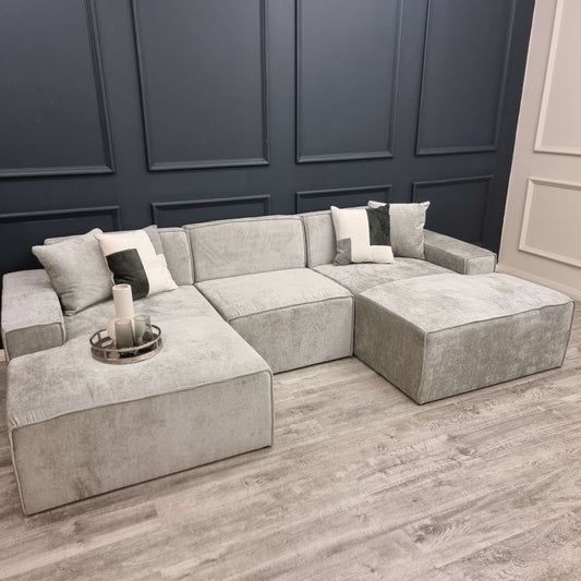 Atlanta Modula Sofa - U Shape Combination by Furnish 365 Limited, showcasing a stylish grey modular design with soft textured fabric and cushions.
