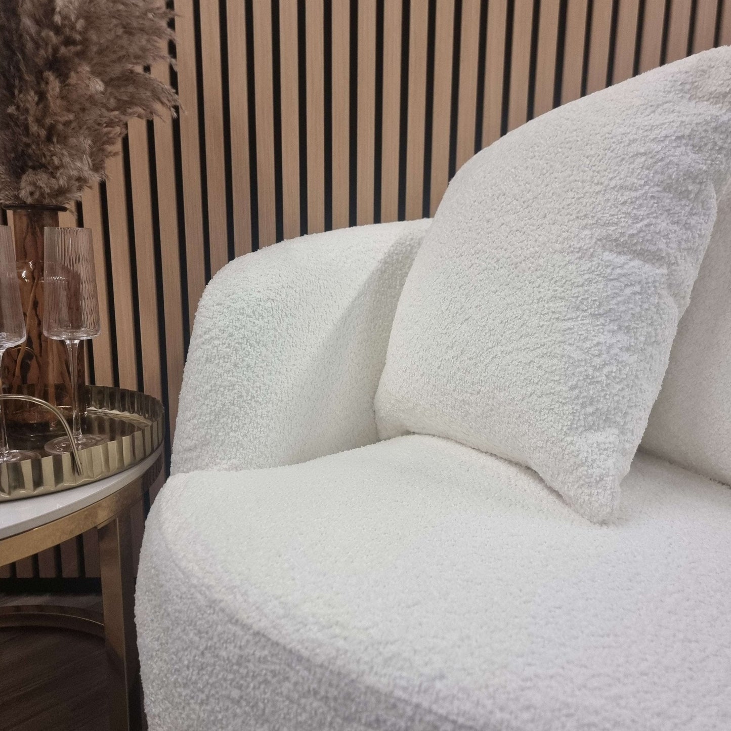 Cuddle Accent Chair - UK Luxury FurnitureCuddle Accent ChairSofasFurnish 365 LimitedUK Luxury Furniture8746763294351550952734343515Close - up view of the Cuddle Accent Chair by Furnish 365 Limited, highlighting the soft boucle fabric and two supportive cushions, perfect for any modern interior.