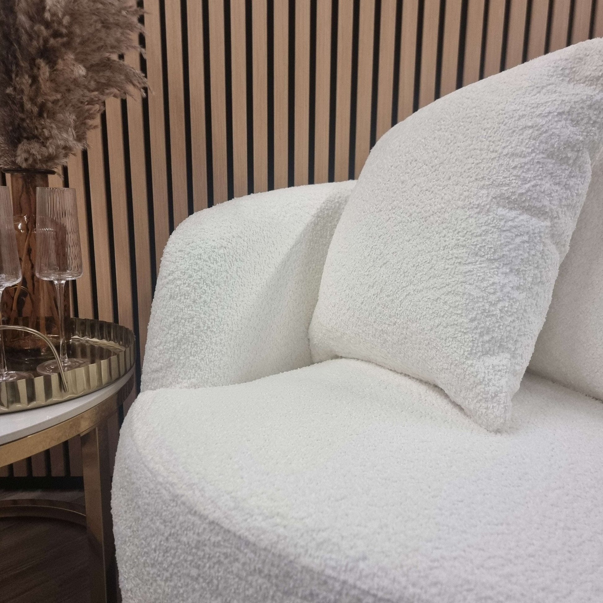 Cuddle Accent Chair - UK Luxury FurnitureCuddle Accent ChairSofasFurnish 365 LimitedUK Luxury Furniture8746763294351550952734343515Close - up view of the Cuddle Accent Chair by Furnish 365 Limited, highlighting the soft boucle fabric and two supportive cushions, perfect for any modern interior.