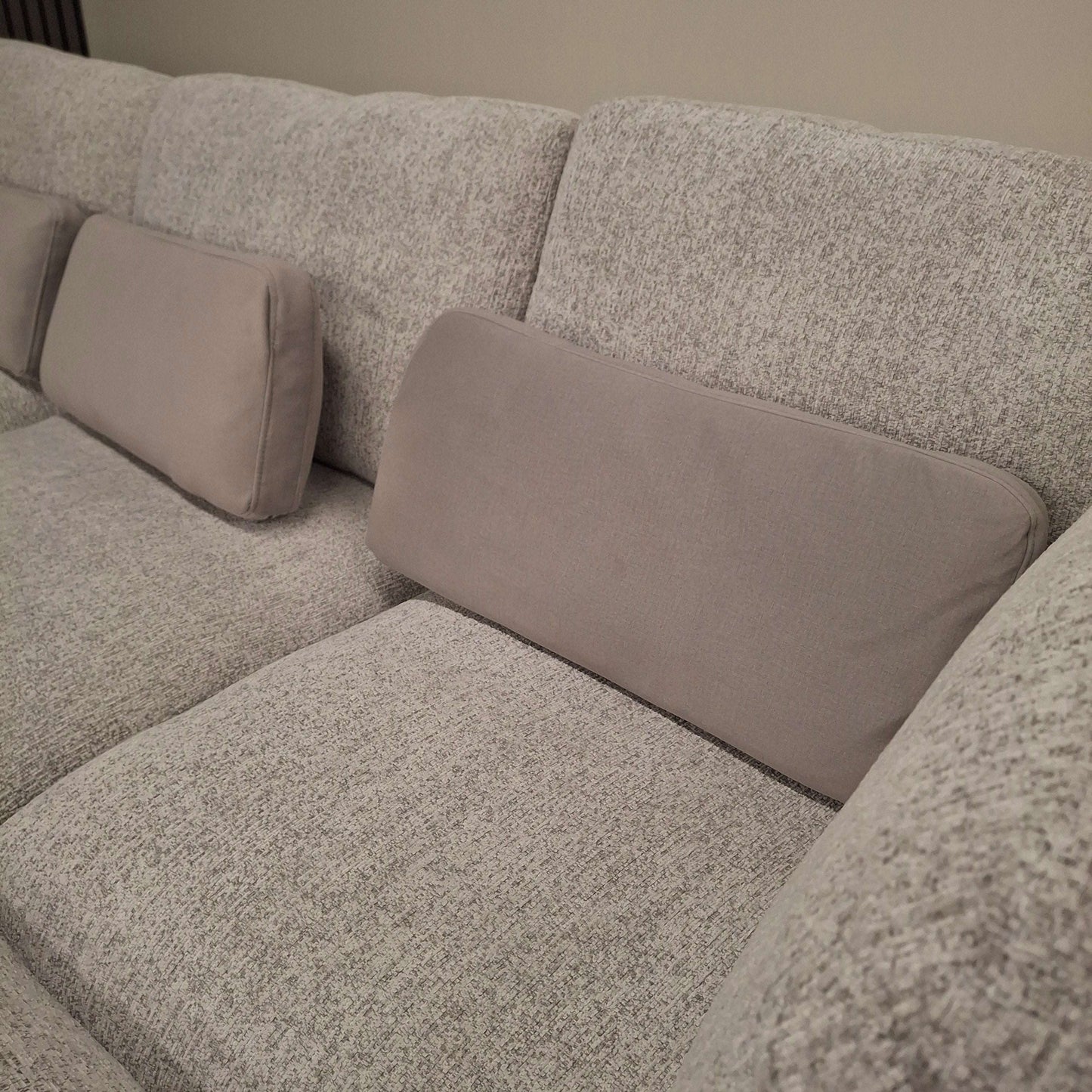 Close-up of the plush backrest and cushions of the U-Shaped Madison Sofa from Furnish 365 Limited in soft grey.