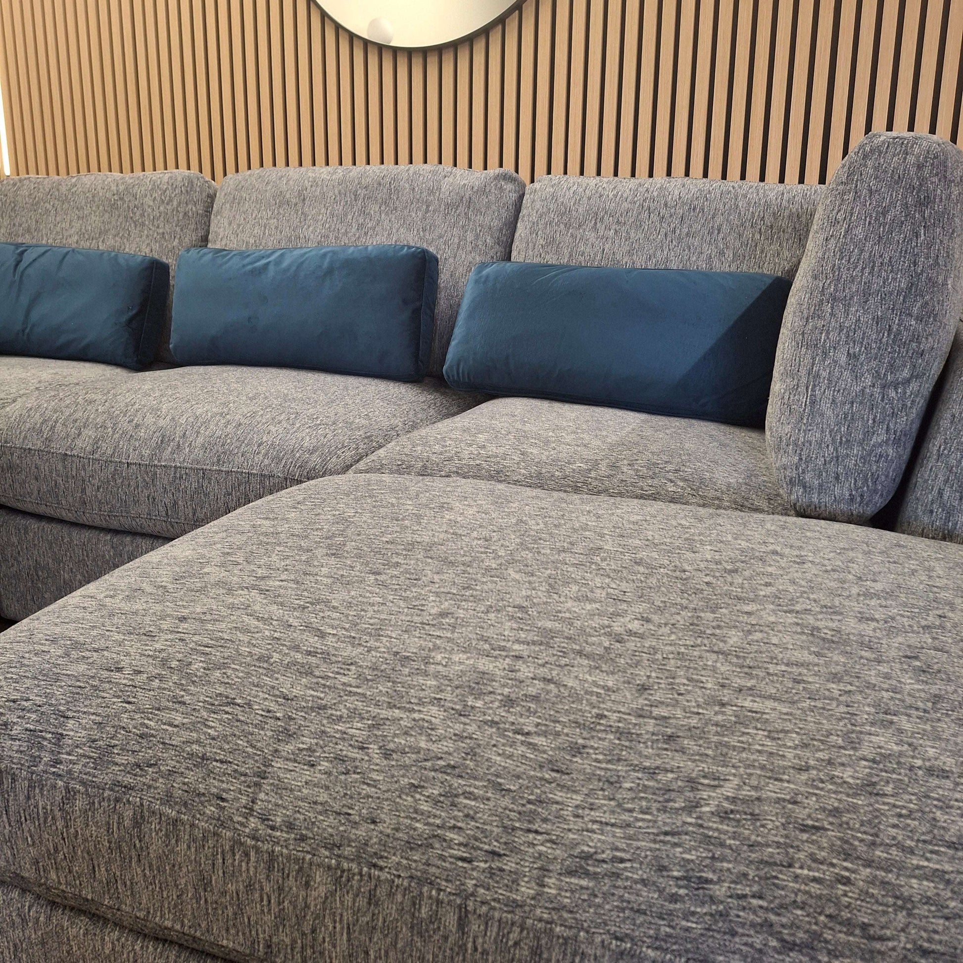 Detail shot of the Madison U Shape Sofa by Furnish 365 Limited, featuring plush cushions and a modern design, set against a stylish backdrop.