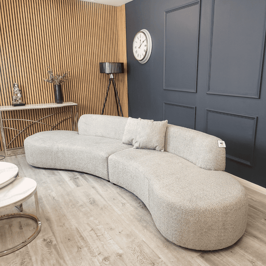 Miami Curved Cinema Boucle Sofa in light grey fabric, showcasing its organic curves in a stylish interior by Furnish 365 Limited.