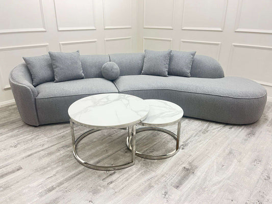 The Pebble Boucle Sofa - UK Luxury FurnitureThe Pebble Boucle SofaSofasFurnish 365 LimitedUK Luxury Furniture8746763218700350952735687003GreyA stylish grey Pebble Boucle Sofa by Furnish 365 Limited, featuring plush cushions and a rounded design, displayed in a modern setting.