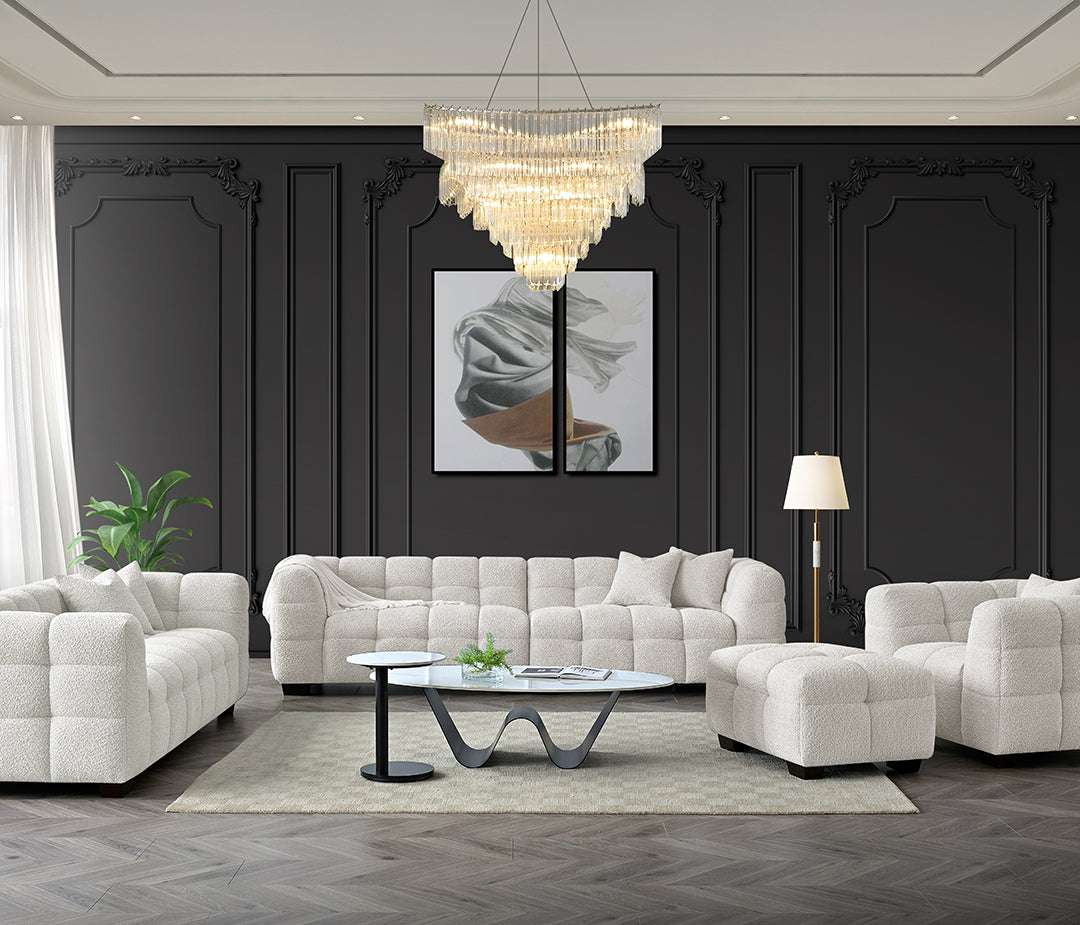 Spacious living room featuring the Tribeca Sofa Range in Oatmeal Boucle Fabric by Aluxo, set against a stylish dark wall with elegant decor including a chandelier and artwork.