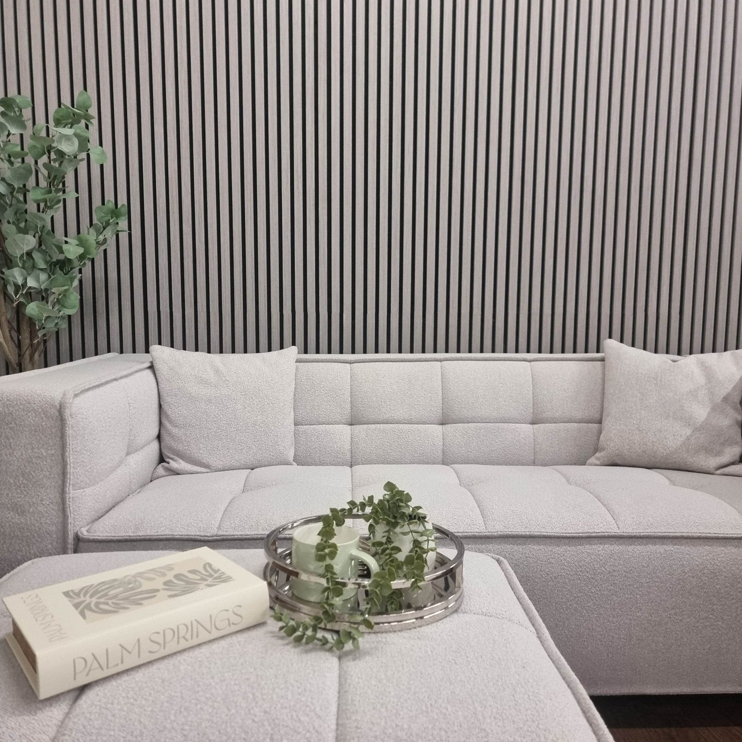 Contemporary corner couch paired with Acoustic Wood Slatted Wall Panels by Furnish 365 Limited, highlighting luxury furniture and adding elegance to the setting.