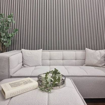 Contemporary corner couch paired with Acoustic Wood Slatted Wall Panels by Furnish 365 Limited, highlighting luxury furniture and adding elegance to the setting.